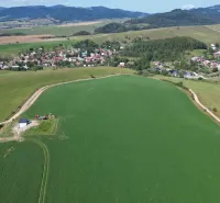 Aerial view of agricultural lands and a village around Stará Ľubovňa.