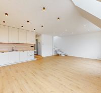Spacious kitchen in a 5 or more room apartment with a wooden decor floor.