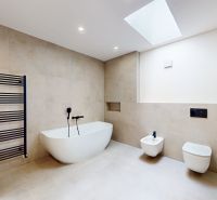A bathroom with a freestanding bathtub, a shower corner, and modern equipment in a 5 or more room apartment.