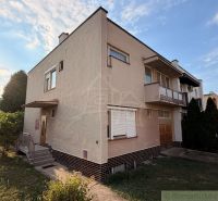 A family house in Nové Zámky with a balcony, garden, and driveway.