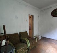 A room in a family house with furniture and a wooden decor floor.