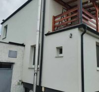 A family house with a balcony in the city with a verified member certificate of a real estate agency.