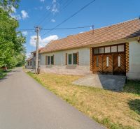 Family house at Vištuk 158 in Vištuk with surroundings and blue sky.