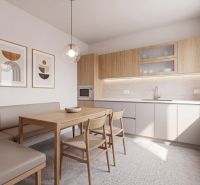A kitchen in a family house with a wood-patterned floor, a dining table, and a built-in oven.