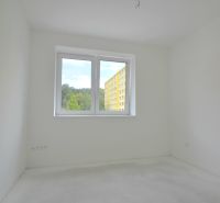 Interior of a bright room with white walls in a 3-room apartment.