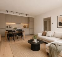 Living room with kitchen, dining table, and wooden decor flooring in a 3-room apartment.
