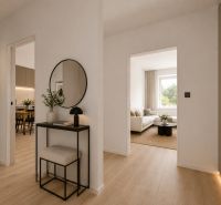 Interior of a 3-room apartment with a wooden decor floor and a mirror on the wall.
