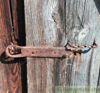 An old wooden fence with a metal latch in Pozemky - housing in Nižné Repaše.