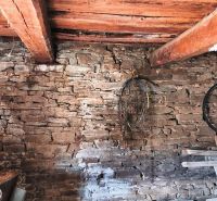 Stone wall and wooden ceiling in the interior, Land - housing.