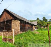 An old wooden house surrounded by greenery suitable for residential land in Nižné Repaše.