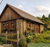 A wooden cottage with stone elements on a residential plot in Nižné Repaše.