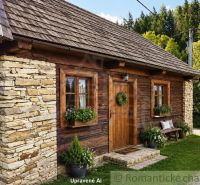 A log cabin with a stone wall in Nižné Repaše on residential land.