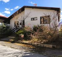A family house on Ľ. Štúra in Veľký Krtíš with abundant greenery and a garage.