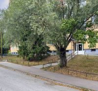 Benadová Street in Košice - Dargovských hrdinov district, an apartment building surrounded by greenery.