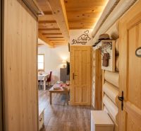 Interior of a family house with wooden details and a floor with a wood decor.