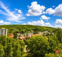 View of greenery and residential buildings in Bratislava-Lamač on Studenohorská Street.