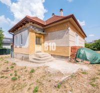 A family house in Nitra with stairs and an unkempt yard.
