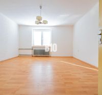 Interior of a family house with a wooden decor floor and white walls.