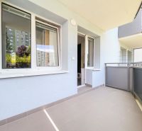 The balcony of a 2-room apartment on Halalovka in Trenčín with a view of the surrounding apartment buildings.