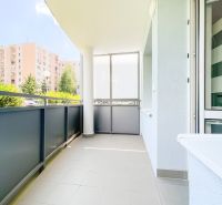 A balcony in a 2-room apartment on Halalovka in Trenčín, with a view of the apartment buildings.