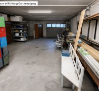 A basement in a family house with colorful cabinets and wooden boards on the shelf.