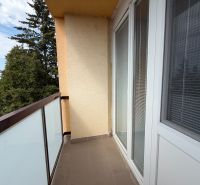 The balcony of a 3-room apartment on Vážska Street in Piešťany with a view of greenery.