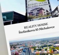 Building with a real estate agency advertisement on Štefánikova Street 10, Michalovce.