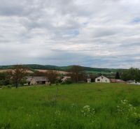 Land for residential use in Tovarnianska Polianka on Hlavná Street with a view of the countryside.
