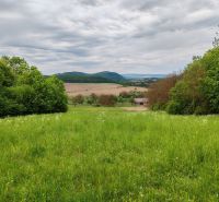 Greenery on the plot in Tovarnianska Polianka on Hlavná, suitable for living, surrounded by trees.