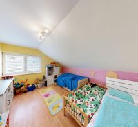 Children's room with wood-patterned flooring in a family house.