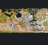 A cottage in Miloslavov at Alžbeta's court surrounded by nature, a swimming pool, and a garden.