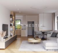Living room of a family house with a wooden decor floor, a sofa, and a dining table.