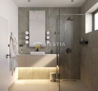 A bathroom in a family house with stone tiles, a shower, and a hanging mirror.