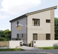 A family house in Cerová with a white facade, modern design, and a landscaped garden.