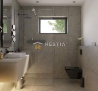 A bathroom in a family house with stylish tiles and modern accessories.
