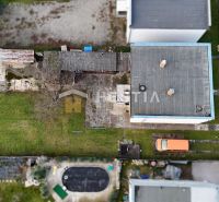 Garden and buildings at a family house in Senica, aerial view of the property and parking.