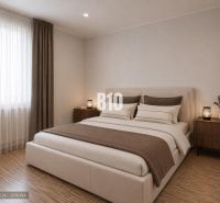 A bedroom in a three-room apartment with light walls and a floor with a wooden decor.