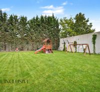 A children's playground with a climbing frame in the garden of a 3-room apartment on Na piesku street.