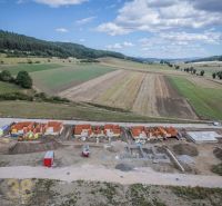 Construction of family houses in Poprad set in a green rural environment.