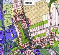 A map of the zoning plan in Raslavice with a designated residential plot.