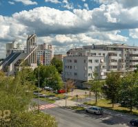 View of Ludvík Svoboda Street in Poprad with a sacral building and apartment blocks.
