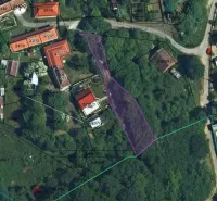 Aerial view of plots and gardens in Kolačno with marked buildings.