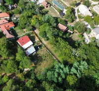 The village landscape of Kolačna is dotted with trees and picturesque buildings in the Gardens.