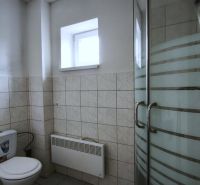 Bathroom with toilet and shower in production facilities.