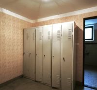 Locker rooms in production areas with metal lockers and ceramic tiles.