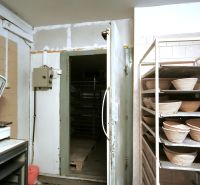 Internal production areas with scales and storage shelves.