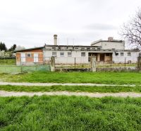 Production premises in Lesenice, fenced, with a large grassy plot and access road.