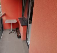 A balcony with red walls in a 2-room apartment on Nábrežná Street in Vrútky.