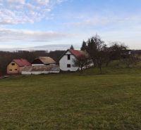 A family house in Dolná Strehová on Prieloh Street surrounded by grassy landscape and trees.