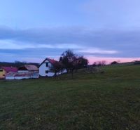 A family house on Prieloh in Dolná Strehová surrounded by nature at dusk.